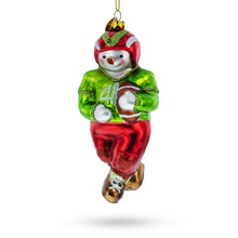 Load image into Gallery viewer, Snowman Playing Football Glass Christmas Ornament