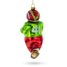 Load image into Gallery viewer, Snowman Playing Football Glass Christmas Ornament