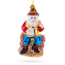 Load image into Gallery viewer, Cowboy Santa with Drink and Drumstick Glass Christmas Ornament