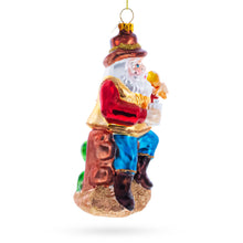 Load image into Gallery viewer, Cowboy Santa with Drink and Drumstick Glass Christmas Ornament