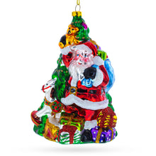 Load image into Gallery viewer, Santa with Christmas Tree and Gifts Glass Ornament