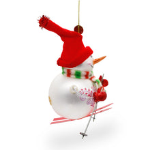 Load image into Gallery viewer, Snowman Skiing Glass Christmas Ornament