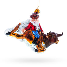 Load image into Gallery viewer, Cowboy Santa Riding Bull Western Rodeo Glass Christmas Ornament