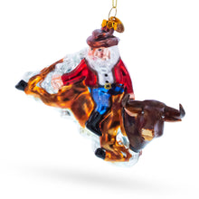 Load image into Gallery viewer, Cowboy Santa Riding Bull Western Rodeo Glass Christmas Ornament