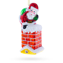 Load image into Gallery viewer, Santa Going Down the Chimney Glass Christmas Ornament