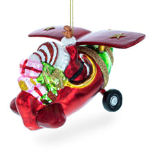 Load image into Gallery viewer, Santa Flying Airplane with Gifts Glass Christmas Ornament