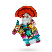 Load image into Gallery viewer, Santa Riding a Festive Pinata Glass Christmas Ornament