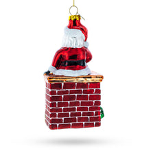 Load image into Gallery viewer, Santa Delivering Presents Down the Chimney Glass Christmas Ornament