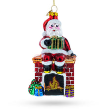Load image into Gallery viewer, Santa Delivering Presents Down the Chimney Glass Christmas Ornament