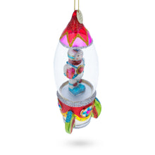Load image into Gallery viewer, Trailblazing Astronaut Inside Spaceship Glass Christmas Ornament