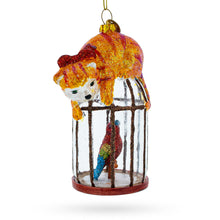 Load image into Gallery viewer, Cat on Birdcage with Parrot Glass Christmas Ornament