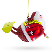 Load image into Gallery viewer, Santa Snowboarding Glass Christmas Ornament