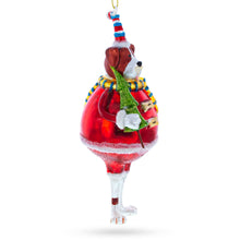 Load image into Gallery viewer, Dog in Fur Hat Holding Tree Glass Christmas Ornament