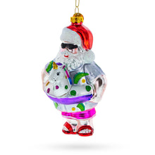 Load image into Gallery viewer, Beach Santa with Unicorn Floatie Glass Christmas Ornament