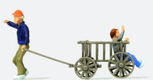 Load image into Gallery viewer, Preiser 28112 HO Scale Man Pulling a Child in a Wooden Cart