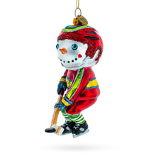 Load image into Gallery viewer, Snowman Playing Hockey Glass Christmas Ornament