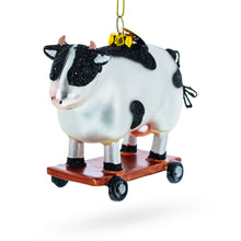 Load image into Gallery viewer, Spotted Cow Ice Skating Glass Christmas Ornament