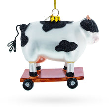 Load image into Gallery viewer, Spotted Cow Ice Skating Glass Christmas Ornament