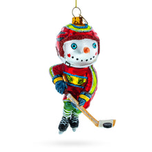 Load image into Gallery viewer, Snowman Playing Hockey Glass Christmas Ornament