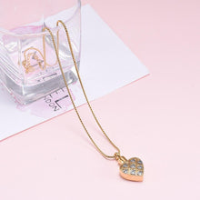Load image into Gallery viewer, Gold Heart Shaped Cremation Urn Necklace With Silver Hearts
