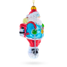Load image into Gallery viewer, Snowshoeing Santa Glass Christmas Ornament