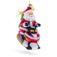 Load image into Gallery viewer, Santa on Snowmobile Glass Christmas Ornament