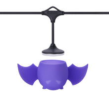 Load image into Gallery viewer, Purple bat-shaped object with a black hanging mechanism on a white background