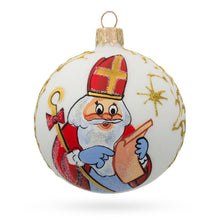 Load image into Gallery viewer, St. Nicholas Perusing His Gift List  Glass Ball Christmas Ornament 3.25 Inches
