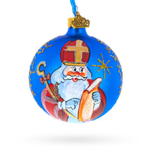 Load image into Gallery viewer, St. Nicholas Reviewing His Gift List Glass Ball Christmas Ornament 3.25 Inches