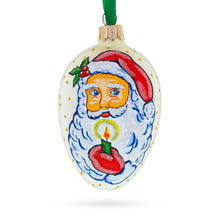 Load image into Gallery viewer, Santa Holding Candle Glass Egg Ornament 4 Inches