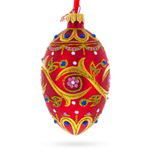 Load image into Gallery viewer, Blue Jewels On Red Glass Egg Ornament 4 Inches