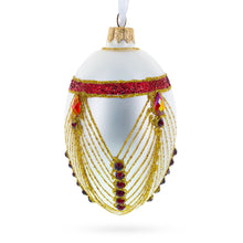 Load image into Gallery viewer, Red Jewels Eccentrics on White Glass Egg Ornament 4 Inches