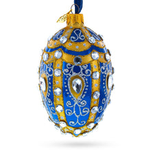 Load image into Gallery viewer, White Scrolls on Blue Glass Egg Ornament 4 Inches