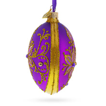 Load image into Gallery viewer, Golden Swirls on Purple Glass Egg Ornament 4 Inches
