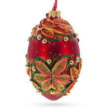 Load image into Gallery viewer, Red and Green Leaves on Red Glass Egg Ornament 4 Inches