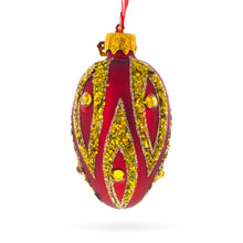 Load image into Gallery viewer, Red with Gold and Green Glitter Flame Design Mini Glass Egg Ornament 2.9 Inches