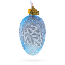 Load image into Gallery viewer, Icy Blue with Silver Pinecone and Snow Design Mini Glass Egg Ornament 2.9 Inches