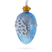 Load image into Gallery viewer, Icy Blue with Silver Pinecone and Snow Design Mini Glass Egg Ornament 2.9 Inches
