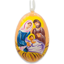 Load image into Gallery viewer, Mary and Joseph Admiring Jesus Wooden Christmas Ornament 3 Inches