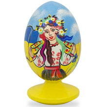 Load image into Gallery viewer, Ukrainian Girl with Flag Easter Egg Figurine