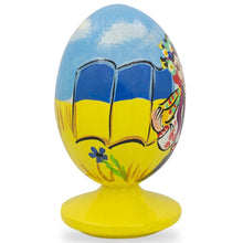 Load image into Gallery viewer, Ukrainian Girl with Flag Easter Egg Figurine